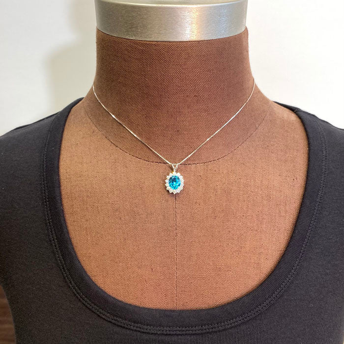 blue zircon and diamond halo pendant
