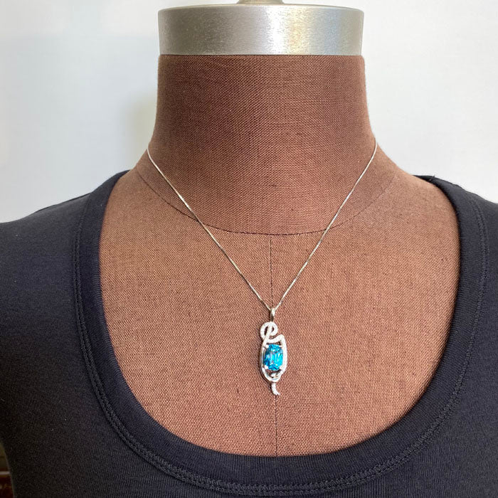 blue zircon and diamond pendant in white gold