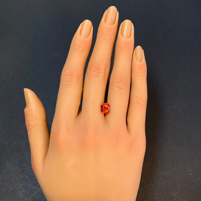 orange sapphire emerald cut gem