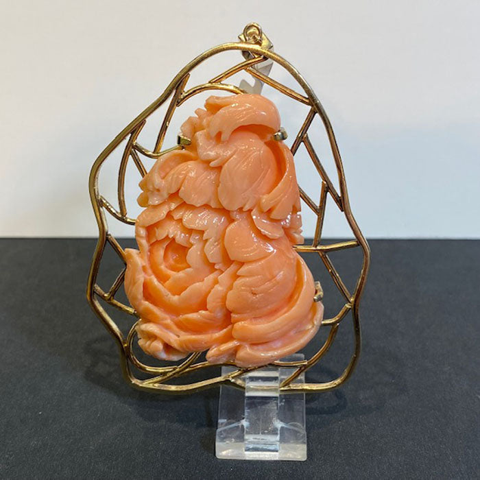 handcarved coral and gold pendant