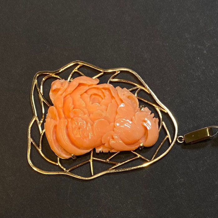 handcarved coral and gold pendant