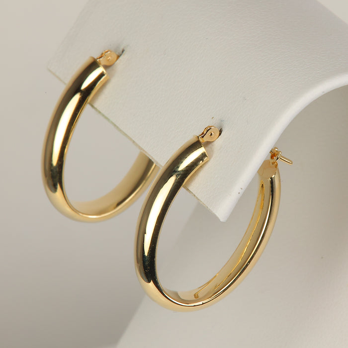 yellow gold elongated hoop earrings