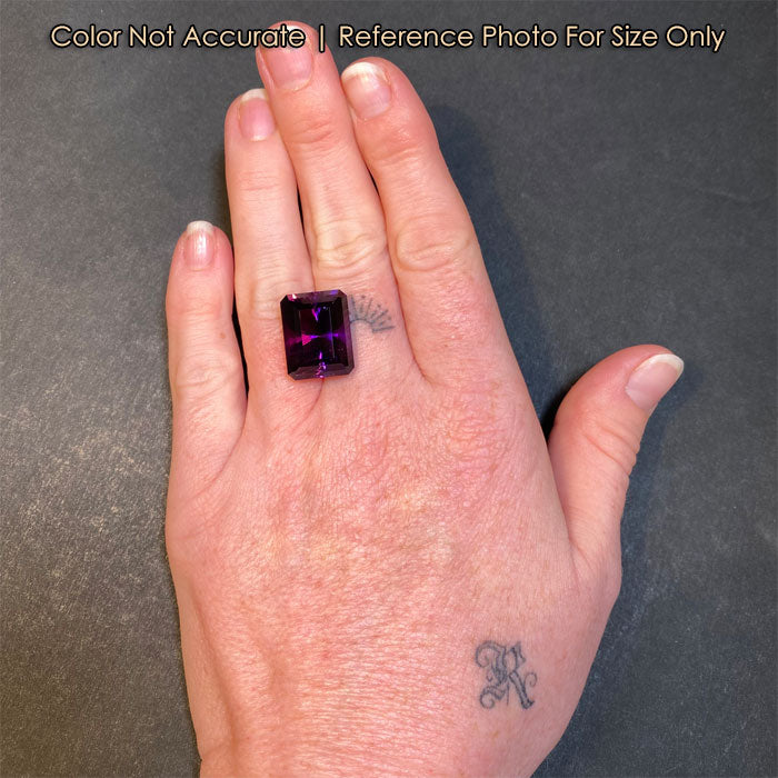 brilliant emerald cut amethyst on hand