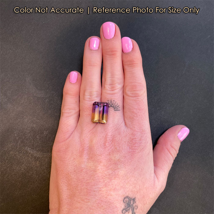 ametrine bicolor gem on hand