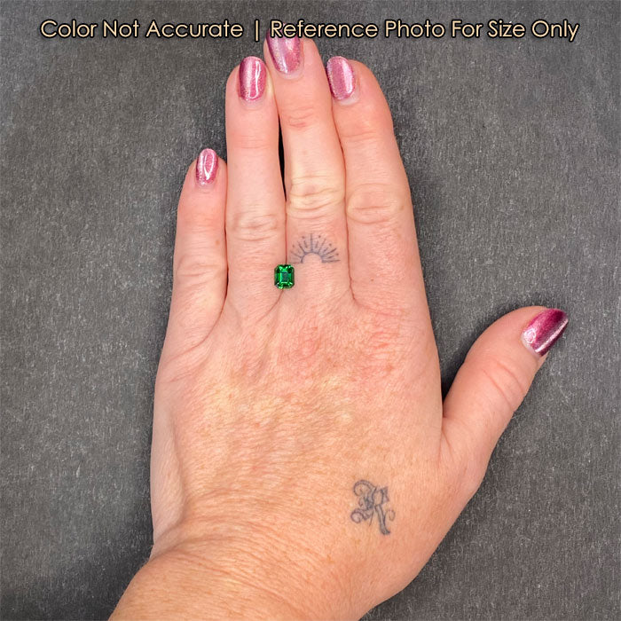tsavorite garnet gem on hand