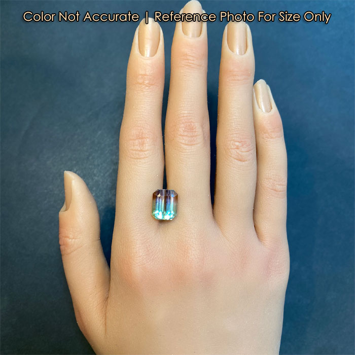 emerald cut bicolor tourmaline size on a hand