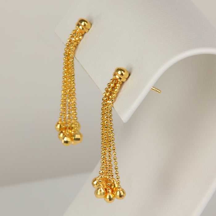yellow gold dangle earrings with faceted gold balls