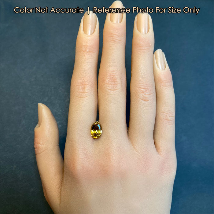 tourmaline stepped pear gem size to a hand