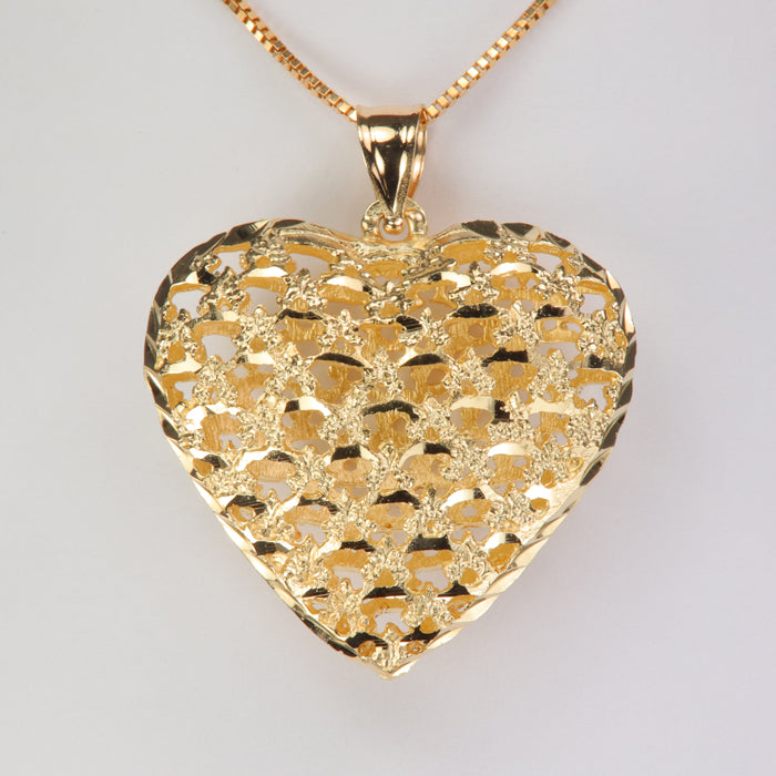 yellow gold heart pendant with filigree design