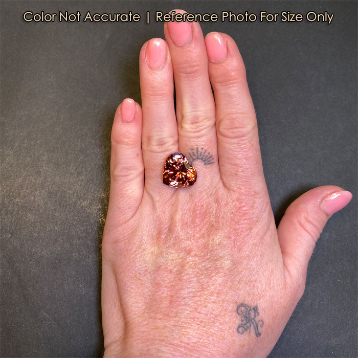 size reference of imperial zircon heart on hand

