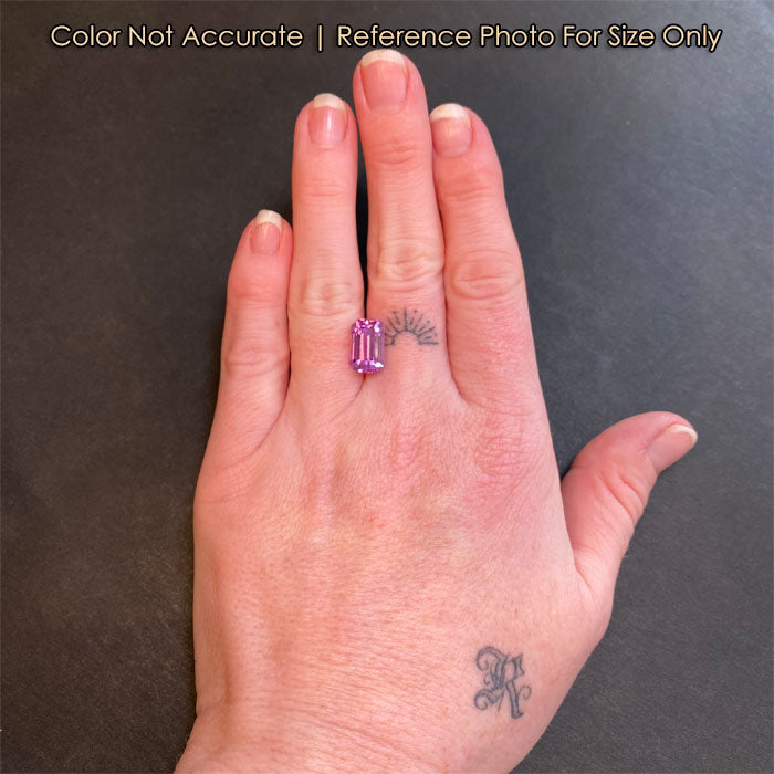 pink emerald cut kunzite on hand