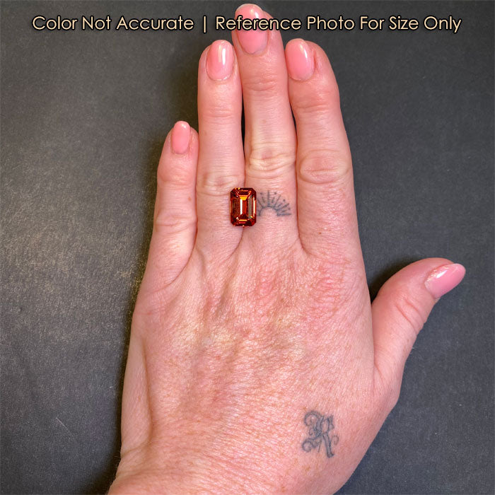 garnet gemstone emerald cut on hand