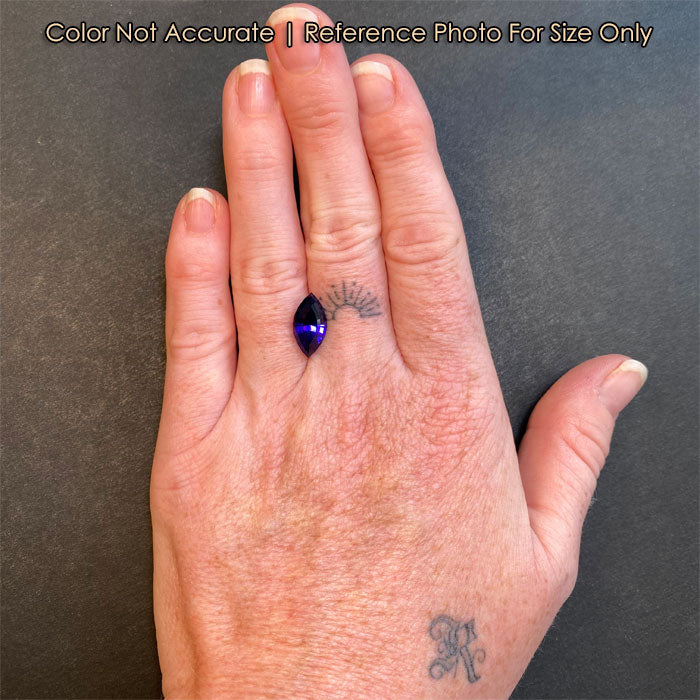 violet tanzanite marquise gemstone on hand