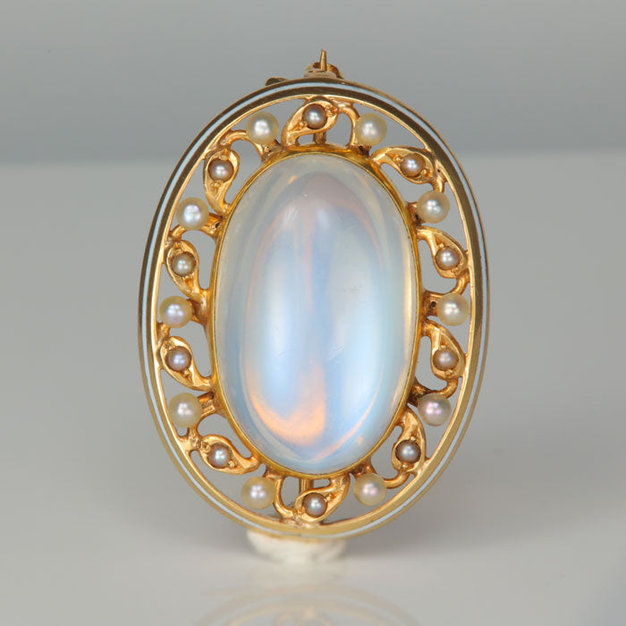 oval cabochon cut moonstone pin with pearls in yellow gold