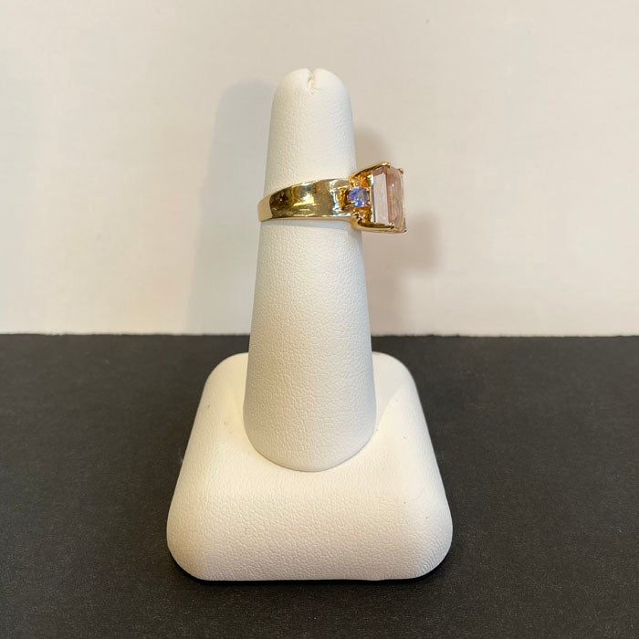 emerald cut morganite and tanzanite ring in yellow gold