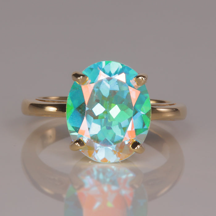 oval cut mystic topaz gemstone ring in yellow gold