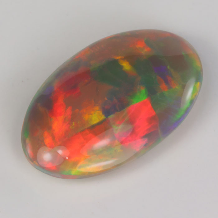 semi black opal gemstone oval cabochon beautiful