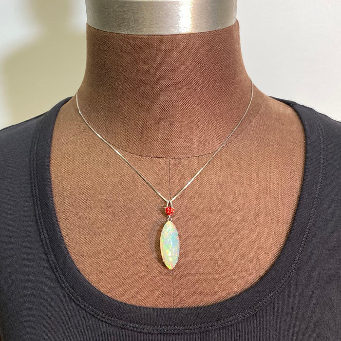 opal pendant with trilliant cut spinel