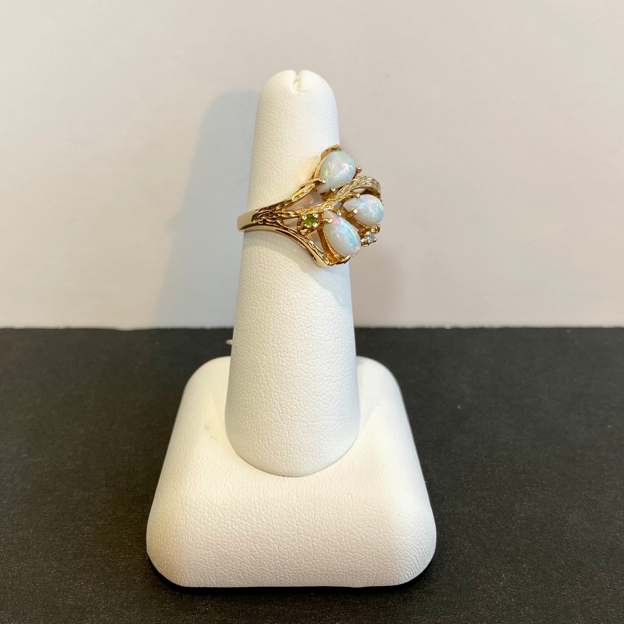 three opal ring with peridot and diamonds