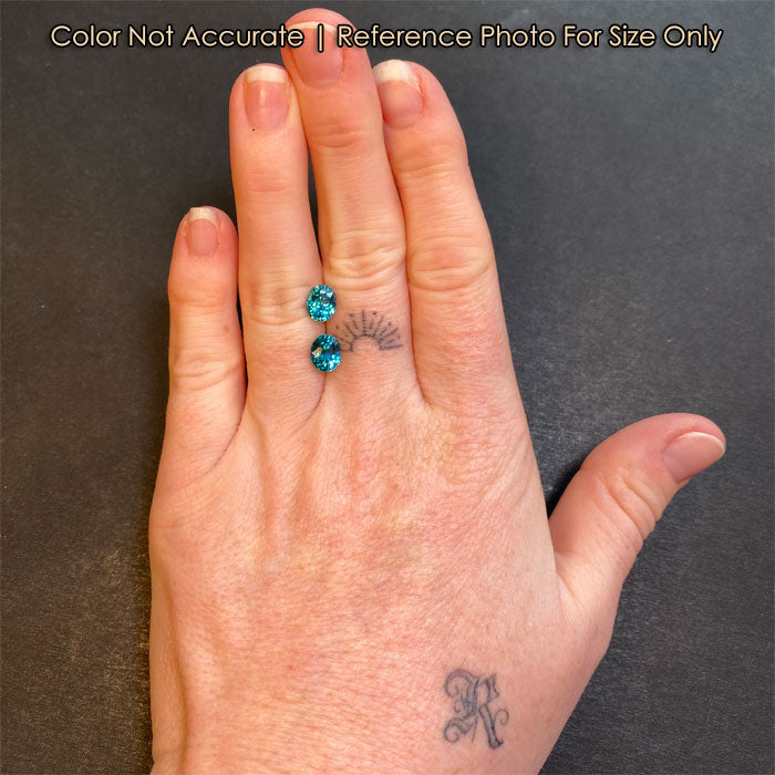 greenish blue oval zircon pair size