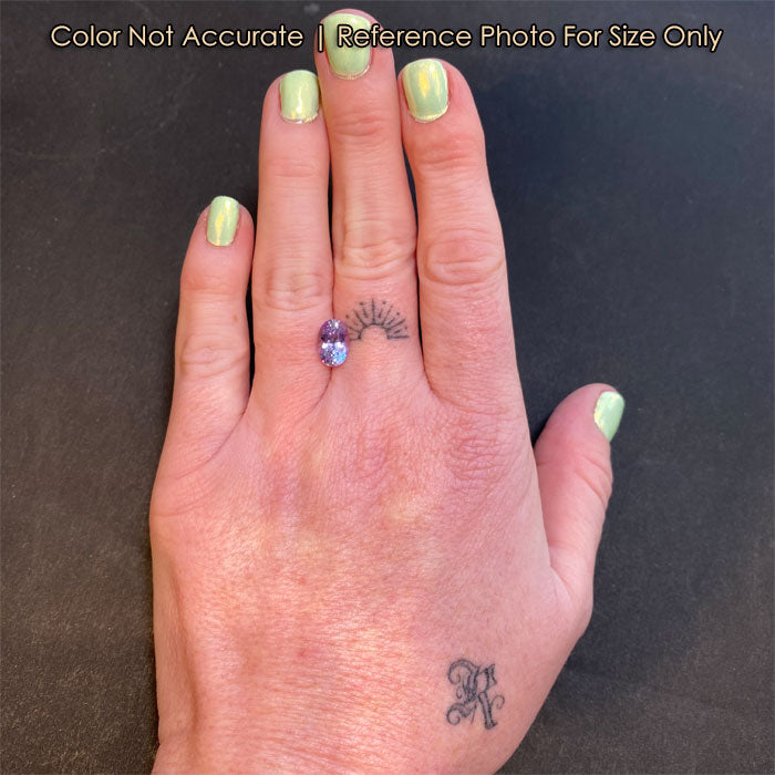 oval cut pink purple sapphire gem size to a hand