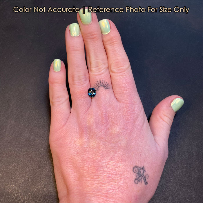 teal oval sapphire size to hand