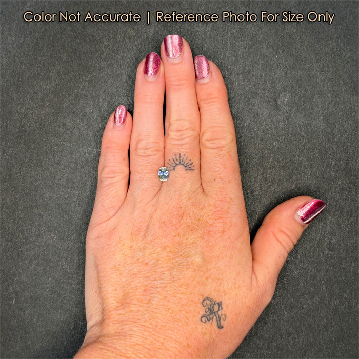 sapphire gemstone on hand bicolor