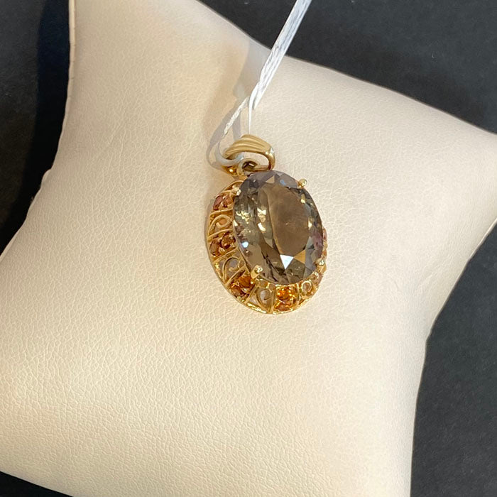 oval cut smoky quartz and spessartite garnet pendant in yellow gold