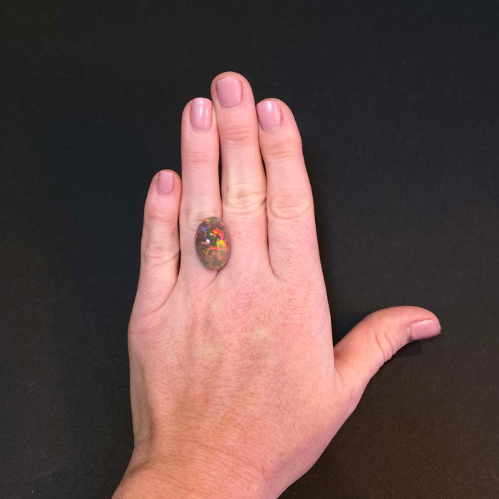 black opal oval cabochon cut