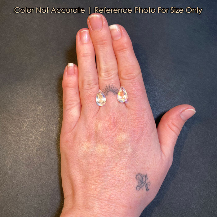 rainbow pear shape moonstone gems on a hand
