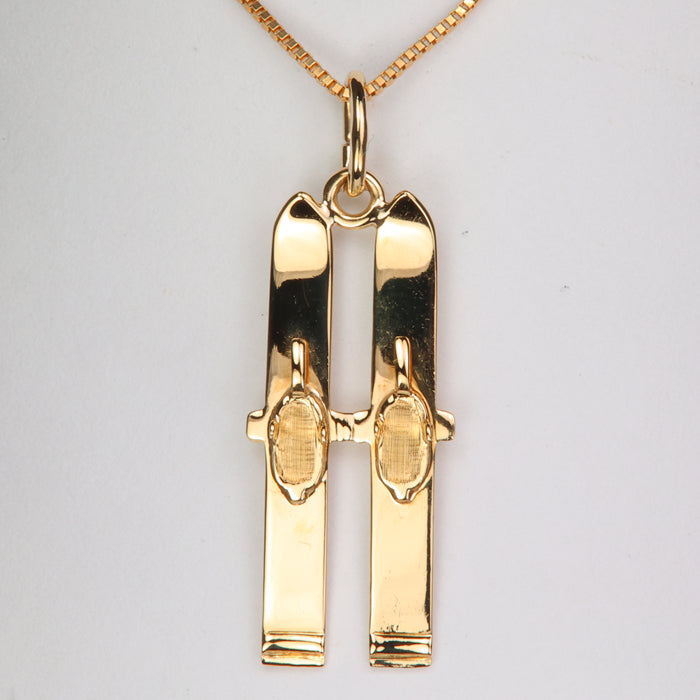 yellow gold estate pair of skis pendant