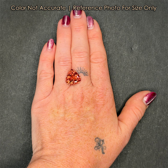 size of peach tourmaline gem to hand 