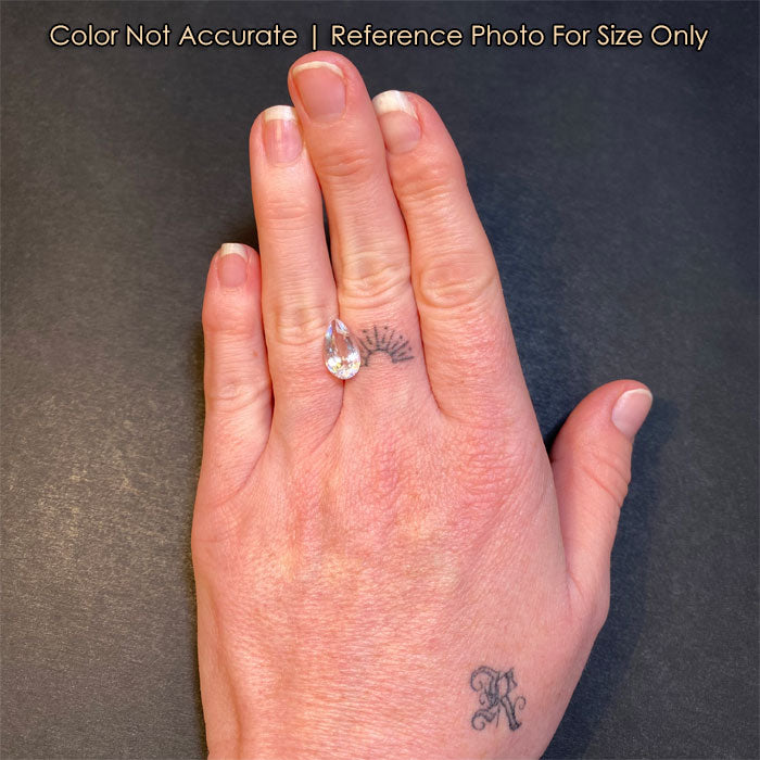 pear shape moonstone gem on hand