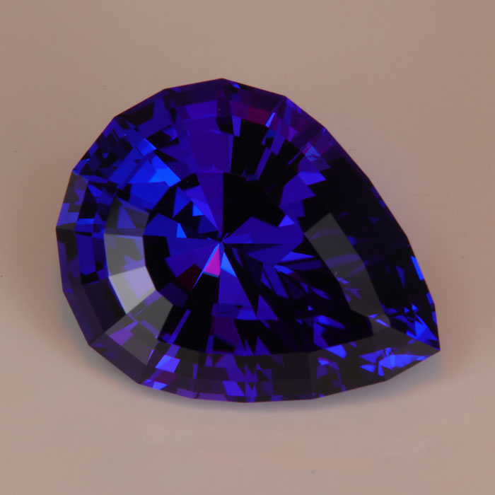 pear shape tanzanite rare gemstone with red flash