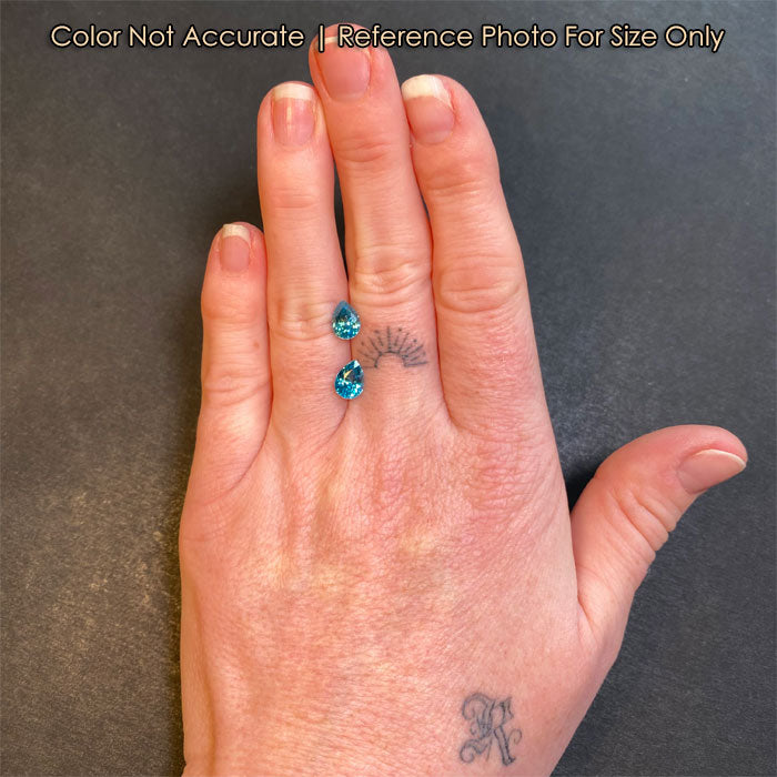 pair of pear blue zircons on hand