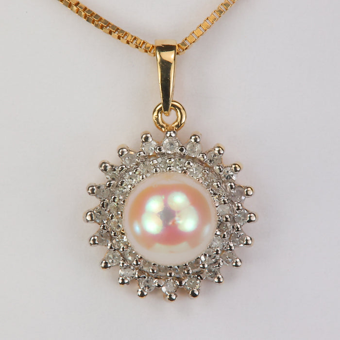 yellow gold pearl pendant with diamond accents