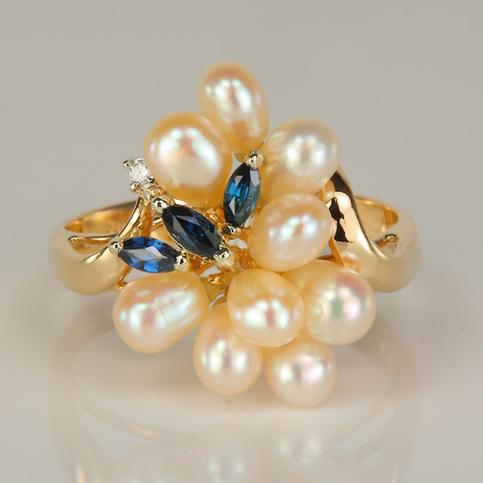 yellow gold ring with pearls sapphire and diamond