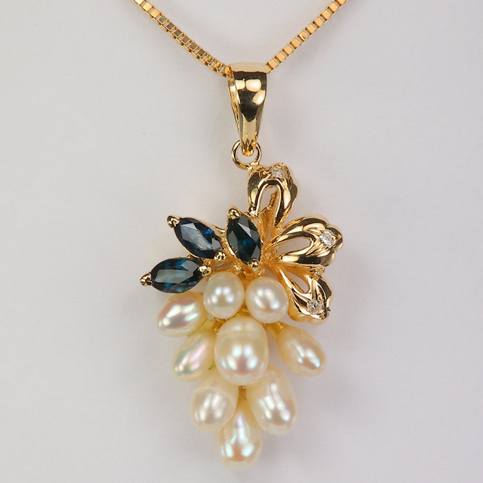 yellow gold pearl and sapphire pendant with diamonds 