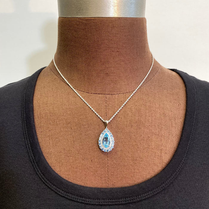 pear shape aquamarine with aquamarine and diamond halo pendant