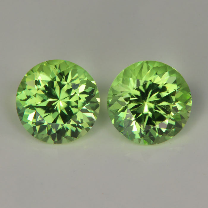 pair of green color round brilliant peridots