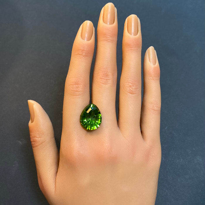 green pear shape peridot gemstone