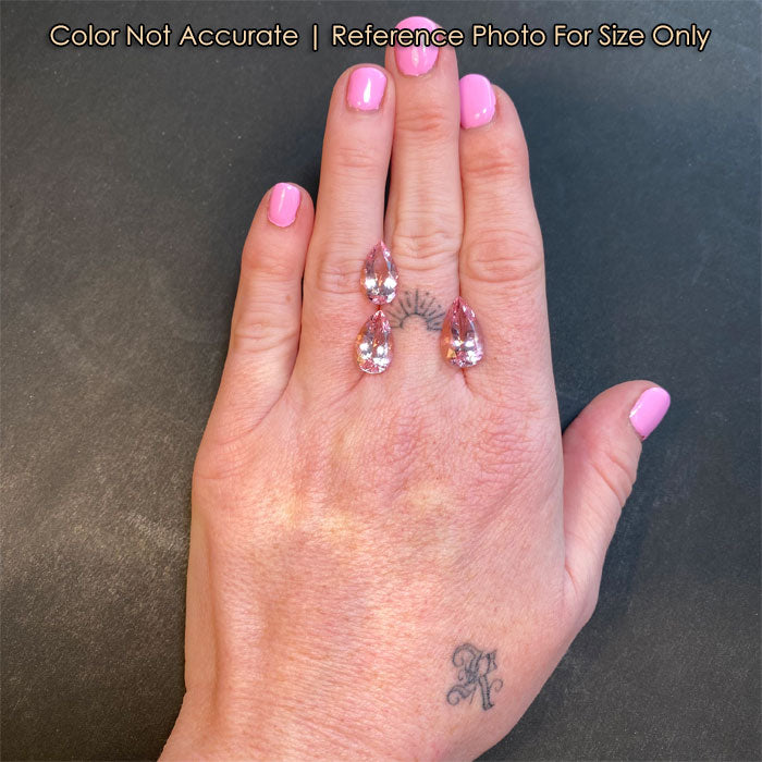 hand size reference of pink pear shape morganite gems