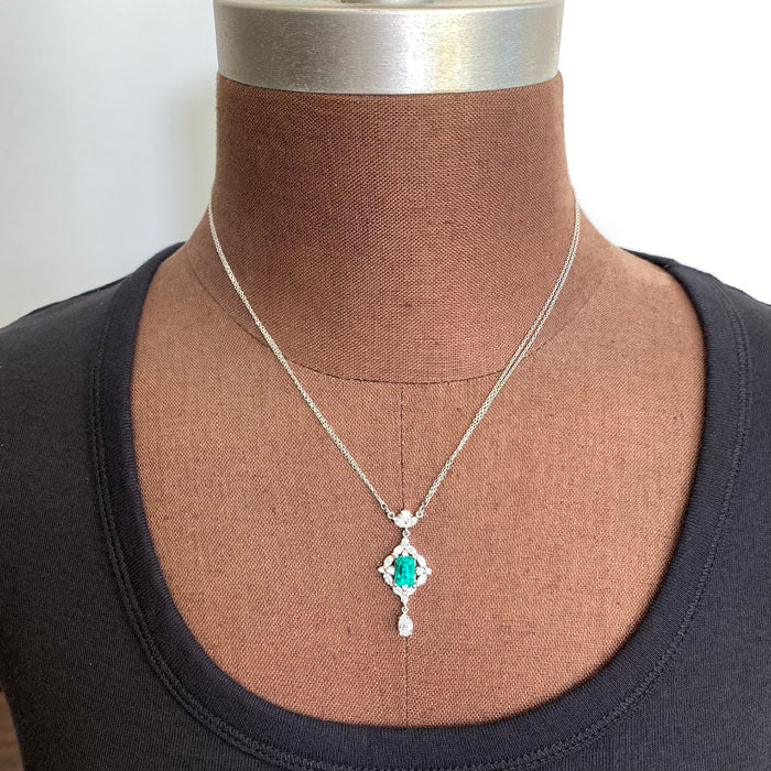 emerald and diamond pendant in platinum