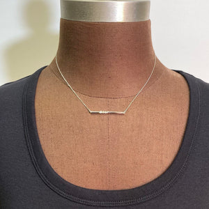platinum bar necklace with natural diamonds