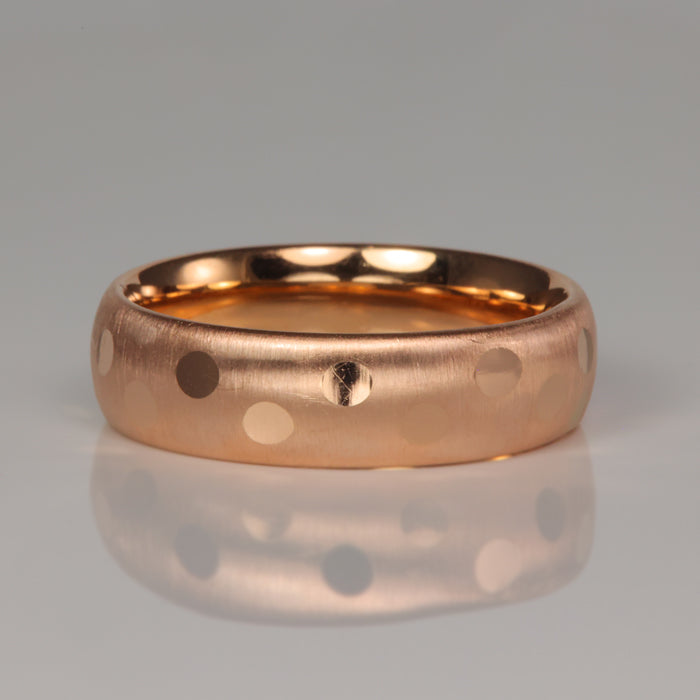 Rose gold ring with polka dot pattern