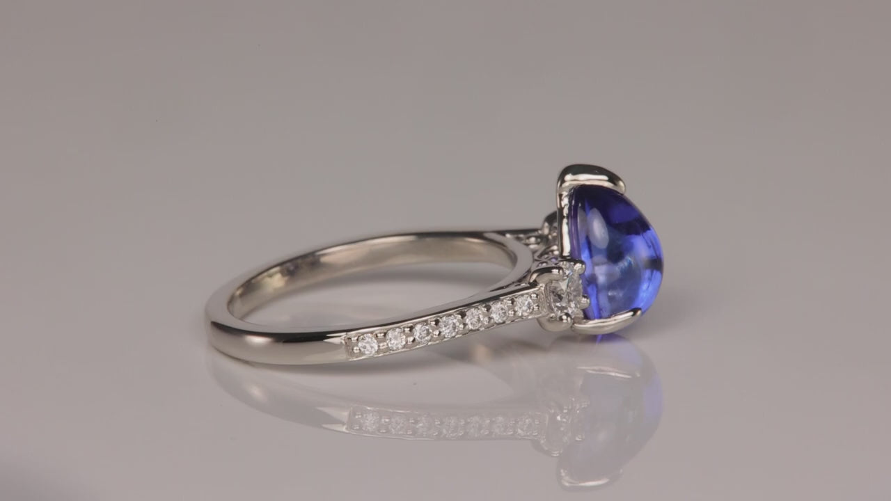 Platinum 2.96 Carat Pear Shape Cabochon Cut Tanzanite and Diamond Ring