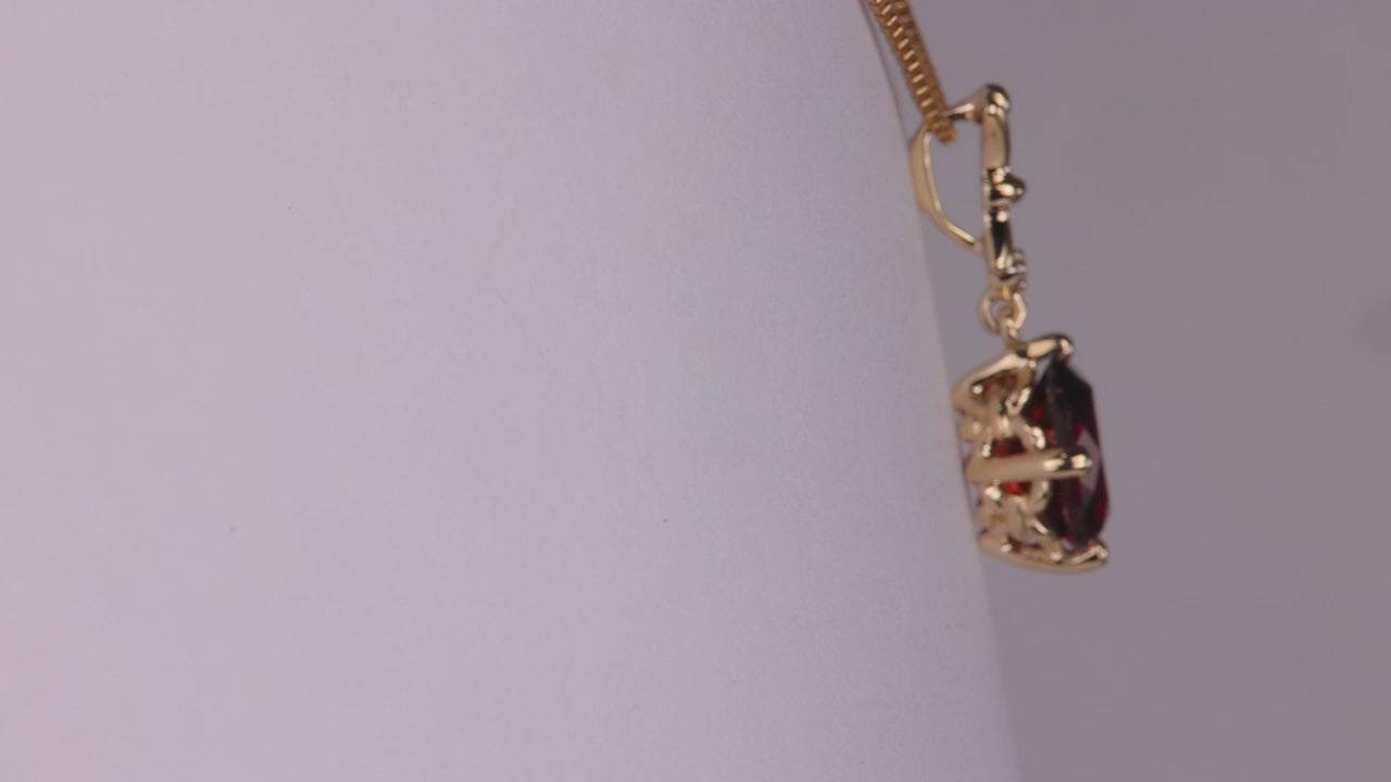 10K Yellow Gold Oval Garnet And Diamond Accent Pendant