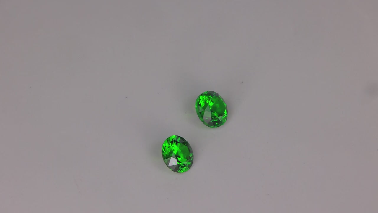 Pair of Round Brilliant Cut Demantoid Garnets From Pakistan 1.22cts