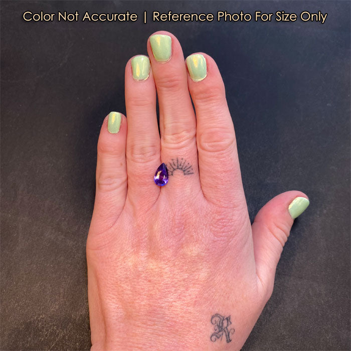 pear shaped purple sapphire size to hand