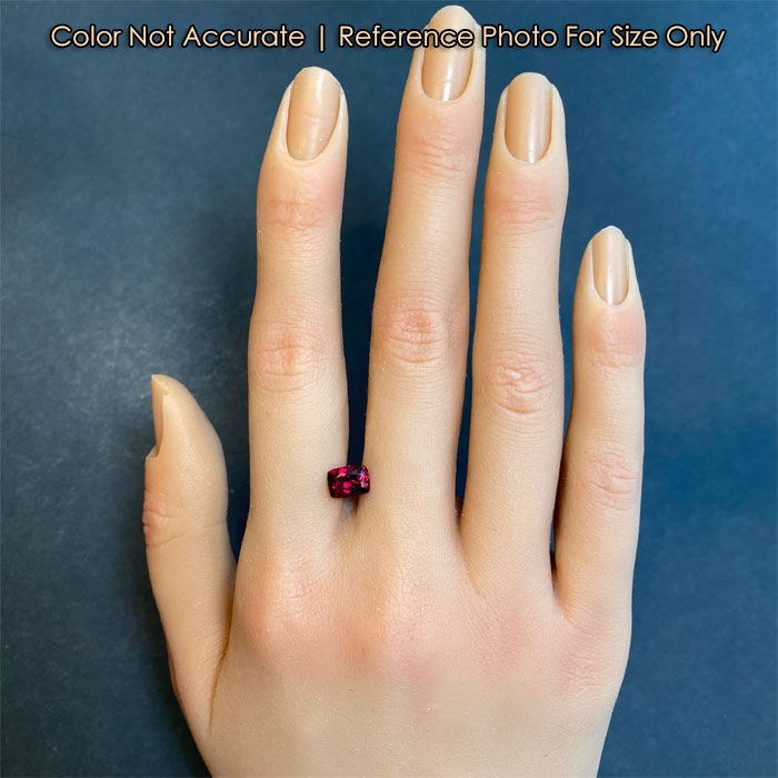 rare red garnet gem on hand